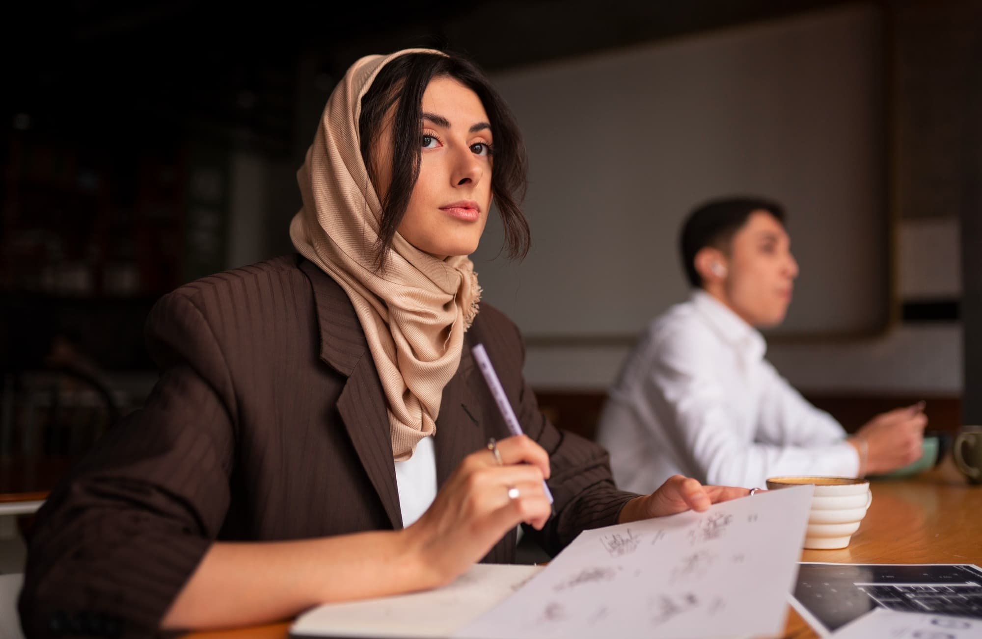 Professional woman wearing hijab in presentation setting